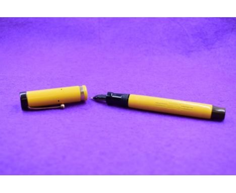 A Parker Duofold Lucky Curve button fill fountain pen in Mandarin yellow with single band to cap, with a Parker Duofold nib. 