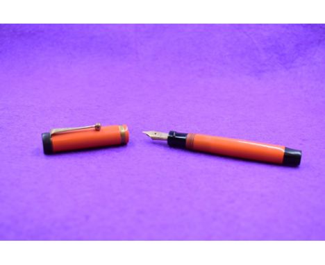 A Parker Duofold Lucky Curve Jr button fill fountain pen in orange with a single band to cap and Parker Duofold P nib. Approx