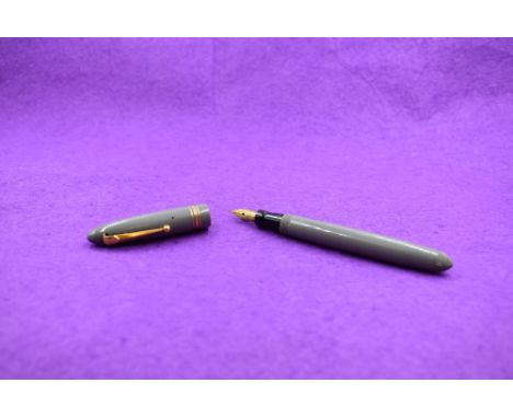 A Mabie Todd &amp; Co Swan 4230 Leverless fountain pen with button fill having two narrow and one broad gold band to cap, wit