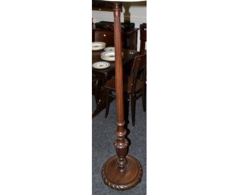 A mid 20th  century fluted standard lamp, dished base, gadrooned border