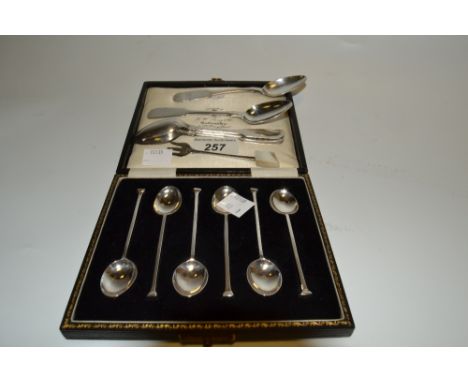 A set of six silver seal top coffee spoons, cased;  four Fiddle pattern teaspoons;  a silver pickle fork 