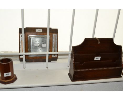 A treen barometer;  a treen letter rack with reeded borders;  a rectangular mahogany writing box, inlaid with brass stringing