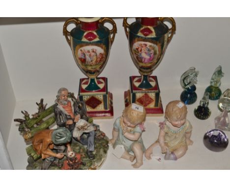 A Capo-di-Monte group, after Natale, The Tramps, 370;  a pair of Austrian Vienna two handled vases, printed with classical fi