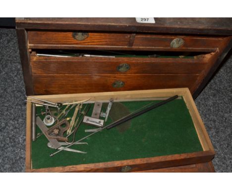 A watchmaker's cabinet with watchmaker's tools