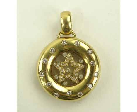 An 18 ct gold floating diamond set circular pendant in the manner of Chopard, central glass panel containing a diamond set st