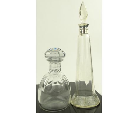 A Baccarat cut glass decanter, height 21 cm and another with silver collar (2)