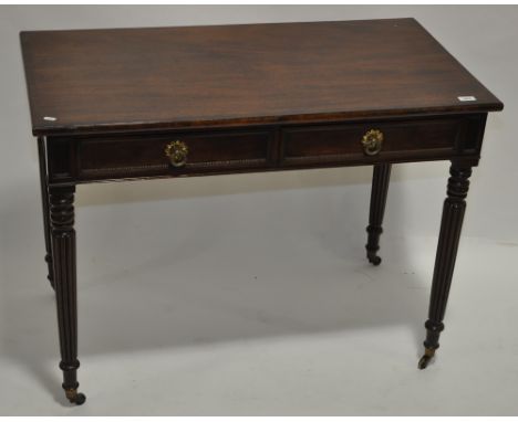 A 19th century rectangular mahogany writing table, 2 moulded panelled frieze drawers, raised on turned & reeded legs, 1.06 m 
