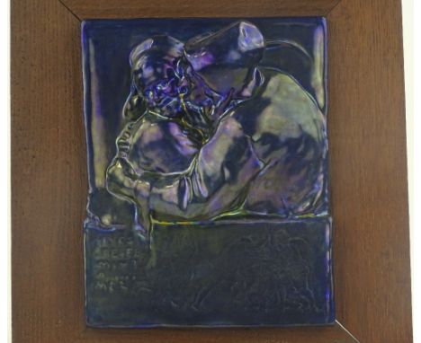 A 19th century Zsolnay Pecs blue Eosian glaze relief ceramic plaque, depicting an amorous couple, indistinct Hungarian text i