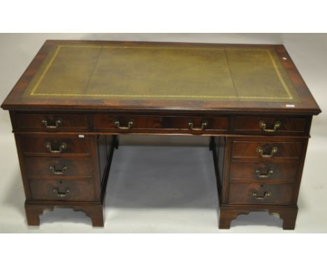 An Edwardian mahogany pedestal desk, green leather top, 9 drawers below and bracket feet, 1.52 m x 91 cm