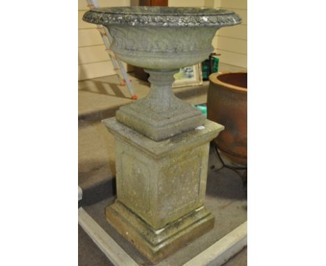 A weathered reconstituted stoneware classical garden urn, with lattice moulded bowl on square column base, urn diameter 75 cm