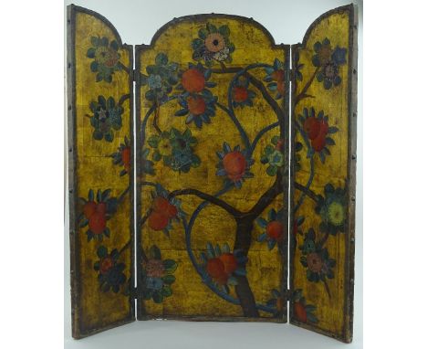 An Arts and Crafts period leather covered 3 fold firescreen, hand painted stylised fruit tree design height 101 cm width 101 