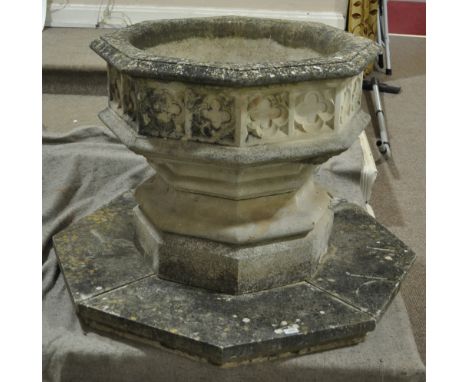 A large Haddonstone reconstituted stoneware Gothic style octagonal garden urn, on stepped platform base, urn diameter 80 cm, 