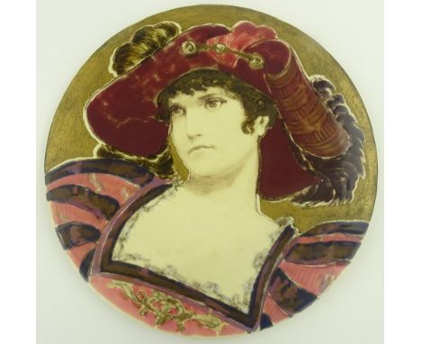 A Zsolnay Pecs plaque, hand painted design of a lady wearing a feather trimmed hat, diameter 37 cm