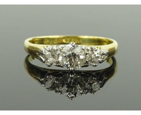 An 18 ct gold 3 stone diamond ring, total diamond content approx 0.5 carat, size M