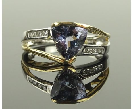 A 14 ct white gold trillion cut tanzanite ring, tanzanite approx 1.75 carats, small diamond set shoulders, size M