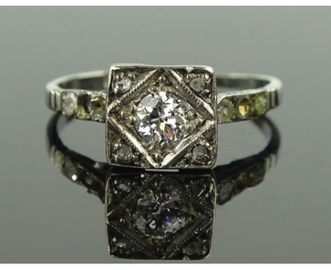 An 18 ct white gold & platinum solitaire diamond ring, setting height 8 mm, size M