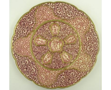 A Zsolnay Pecs relief embossed plaque, central panel decorated with classical figures, diameter 36. 5 cm