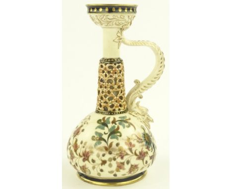 A Zsolnay Pecs candle holder, gilded gurgle fish design handle, with pierced column and painted and gilded vessel, pattern no