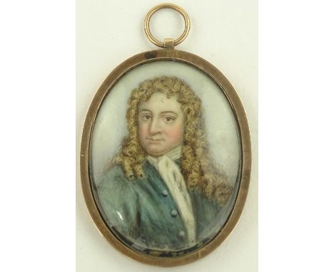 A 19th century miniature watercolour on ivory, portrait of a gentleman wearing a wig, unmarked oval gold frame, height 45 mm