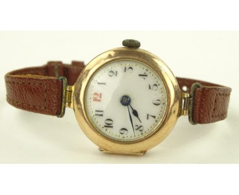 A ladies gold cased wristwatch with gilded enamel dial, case no 205586, case width 26 mm