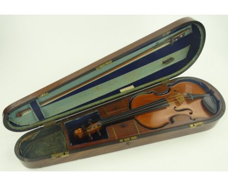 A satinwood backed violin, bearing Stradivarius label, body length 36 cm, with bow, in Victorian mahogany case with brass car