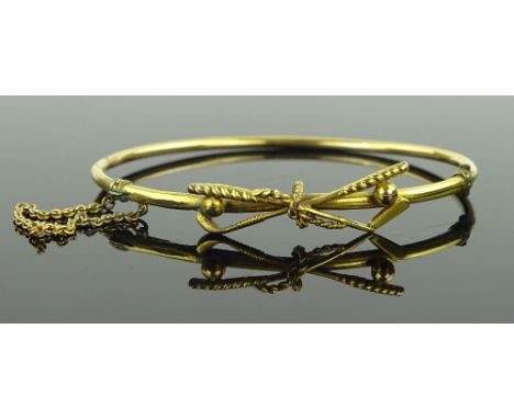 A 9ct gold golf design hinged bangle, 7.8 grams