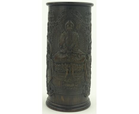 A large Chinese cylindrical hardwood brush pot, detailed relief carved surround depicting deities, height 30 cm diameter 13.5