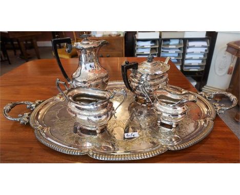  A Victorian Engraved Two Handled Silver Plated Serving Tray, together with a four piece silver plated tea service, (5)