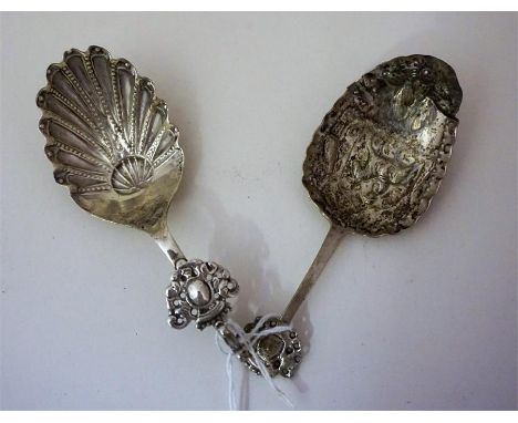 Two 18th Century Dutch Silver Caddy Spoons, one bearing embossed decoration, 1.230 oz, (2)