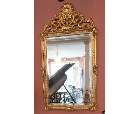 A Reproduction Gilt Pier Mirror & Gilt Console Table, in the Rococco style, (mirror 123cm high, 63cm wide) (table 74cm high, 