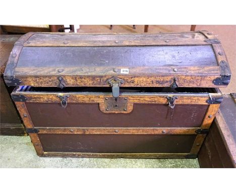 A Vintage Canvas & Oak Travel Trunk, with domed top, 62cm high, with contents, (a lot)