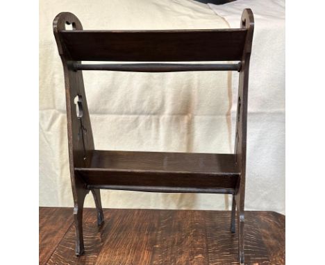 An Art Noveau style mahogany magazine rack 