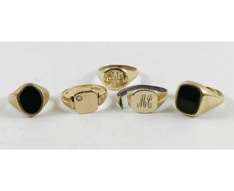 Four 9ct gold signet rings, two set with blood stone, 23.9g gross; together with a silver gilt signet ring