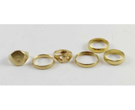 A 22ct gold wedding band, 3.64g gross; three 18ct gold wedding bands, 8.52g gross; an unmarked gold signet ring, 7.95g gross,