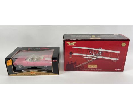 A boxed Maisto Cadillac Eldorado Biarritz model car, along with a Corgi "Wright flyer"