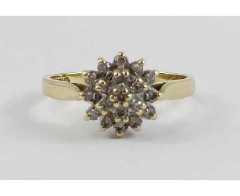 An 18ct gold diamond cluster ring, finger size K 1/2, 3.03g gross