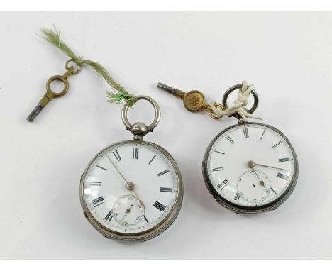 An unnamed silver open face pocket watch, the round white enamel dial with black Roman numerals, gold hands and subsidiary di