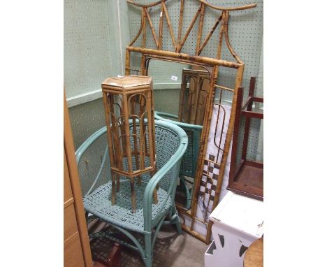 A bamboo-framed wall mirror, 146 x 81cm overall, a painted wicker conservatory chair and a plant stand, (3).