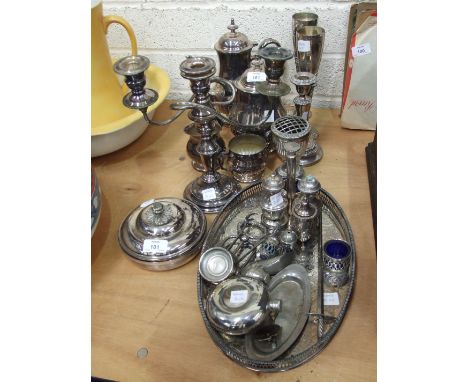 A plated four-piece tea service, a three-branch candelabrum, a muffin dish with cover and other platedware.