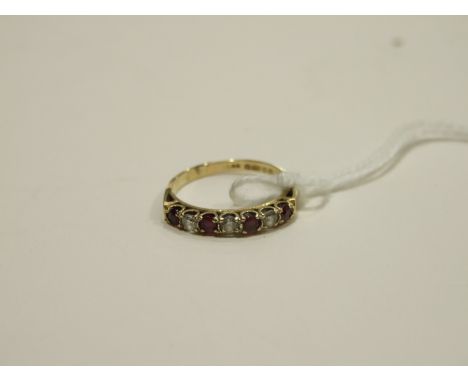 A ruby and diamond half-hoop ring claw-set three brilliant-cut diamonds, set alternately with four round-cut rubies, size N, 