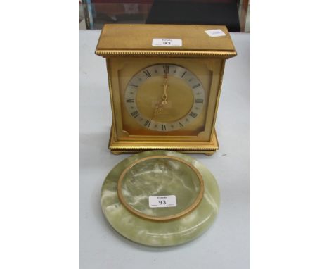 A Luxor brass cased striking mantel clock, the dial marked Ollivant & Botsford, 19cm high and an onyx shallow circular dish, 