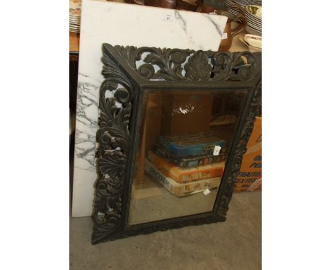 A carved ebonised-frame rectangular wall mirror, 64 x 84cm overall, one other mirror and a marble rectangular games top, 45.5