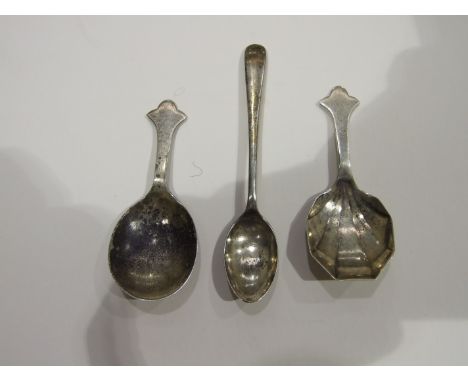 Two silver caddy spoons, Sheffield 1928 and 1936 and a silver coffee spoon, (3).