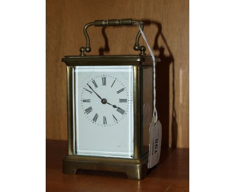 A 20th century French brass carriage timepiece with white enamel dial, (a/f), 14cm overall.