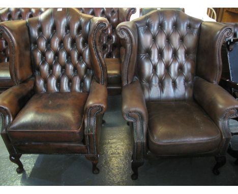 Two similar modern burgandy button back chesterfield style wing armchairs on cabriole legs. (2)(B.P. 24% incl. VAT) 