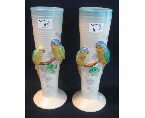Pair of 1950's Clarice Cliff Newport pottery budgerigars vases of tapering ribbed form. Printed marks to the base. Height 32c