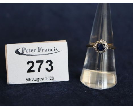 An 18ct gold diamond and sapphire ring. Ring size M, weight 3.1g approx.(B.P. 24% incl. VAT) 