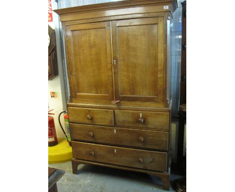 Early 19th Century Welsh oak two stage blind panelled press cupboard with an arrangement of four drawers on bracket feet. (B.