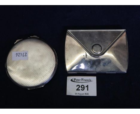 Silver plated three stars letter shaped compact, together with an engine turned silver compact. (2)(B.P. 24% incl. VAT) 