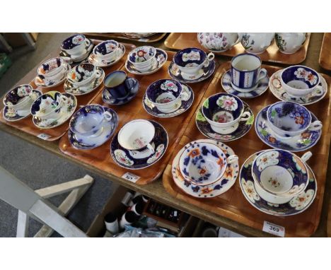 Three trays of 19th Century 'Gaudy Welsh' cabinet cups and saucers of varying designs and including one trio set, 18 cups and